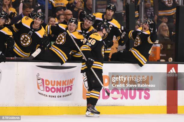 Matt Grzelcyk of the Boston Bruins celebrates his first NHL goal in the second period against the Pittsburgh Penguins at the TD Garden on November...