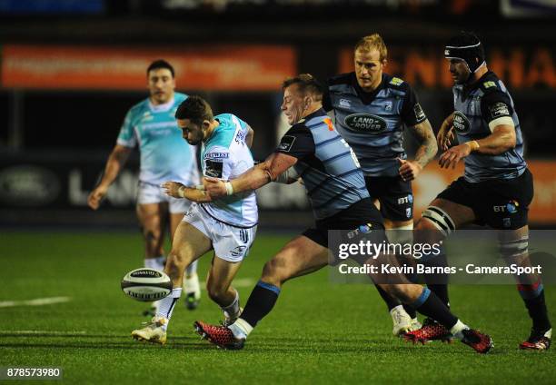 Connacht's Caolin Blade kicks through despite the attentions of Cardiff Blues' Matthew Rees during the Guinness Pro14 Round 9 match between Cardiff...