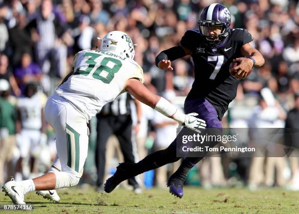 Kenny Hill of the TCU Horned Frogs carries the ball against Jordan Williams of the Baylor Bears in the second half at Amon G. Carter Stadium on...