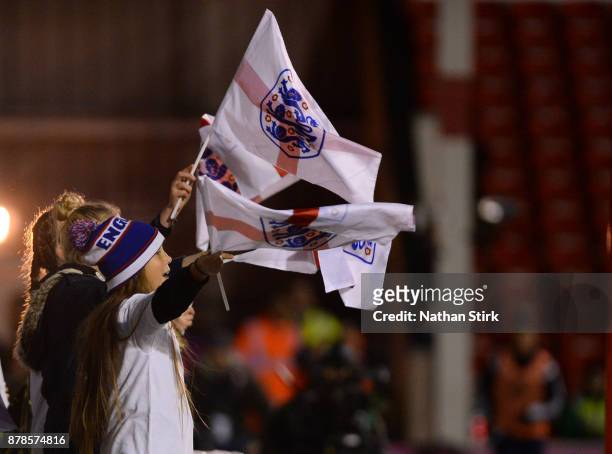 England fans wave there flags during the FIFA Women's World Cup Qualifier between England and Bosnia at Banks' Stadium on November 24, 2017 in...