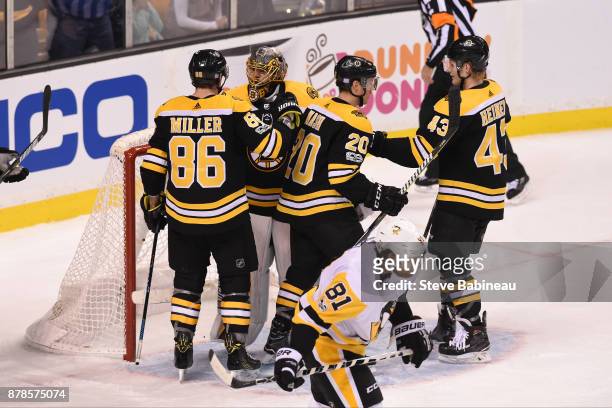 Kevan Miller, Anton Khudobin, Riley Nash and Danton Heinen of the Boston Bruins celebrate a win against the Pittsburgh Penguins at the TD Garden on...