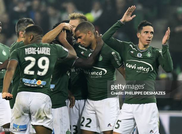 Saint-Etienne's French forward Kevin Monnet-Paquet is congratulated by teammates after scoring during the French L1 football match between AS...