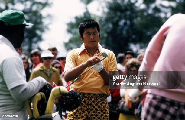 Masashi Ozaki checks his club during the 1973 Masters Tournament at Augusta National Golf Club in April 1973 in Augusta, Georgia.