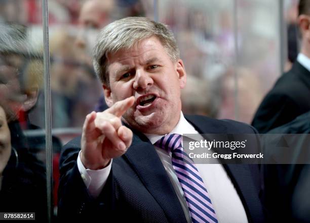 Head coach Bill Peters of the Carolina Hurricanes directs the team in the ice during an NHL game against the New York Islanders on November 19, 2017...