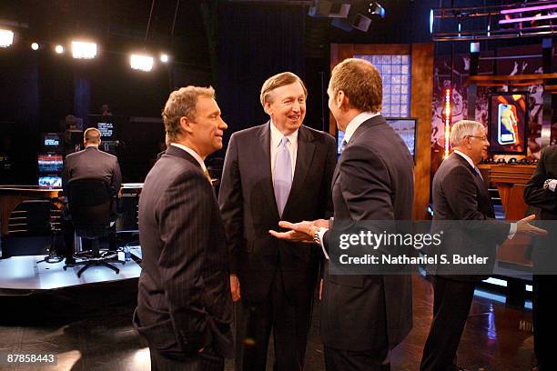 President Rod Thorn of the New Jersey Nets speaks to President and General Manager Bryan Colangelo of the Toronto Raptors and head coach Flip...