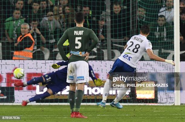 Strasbourg's French midfielder Jonas Martin scores a penalty past Saint-Etienne's French goalkeeper Stephane Ruffier as Saint-Etienne's French...