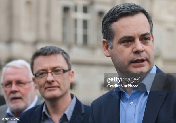 Sinn Fein's Pearse Doherty , accompanied by , Martin Ferris and David Cullinane , speaks to the media outside Leinster House in Dublin. In Dublin,...