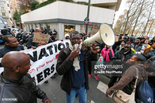 Protesters shout slogans during a demonstration against slavery in Libya on November 24 outside the Libyan embassy in the French capital Paris.