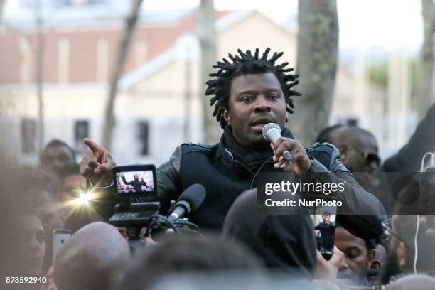 French rap singer Rost speaks outside the Embassy of Libya in Paris during a demonstration againts slavery in Libya on November 24, 2017.