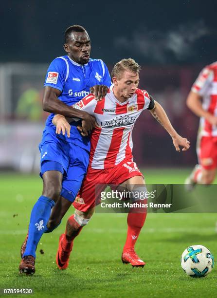 Wilson Kamavuaka of SV Darmstadt 98 and Simon Hedlund of 1 FC Union Berlin during the Second Bundesliga match between Union Berlin and SC Darmstadt...