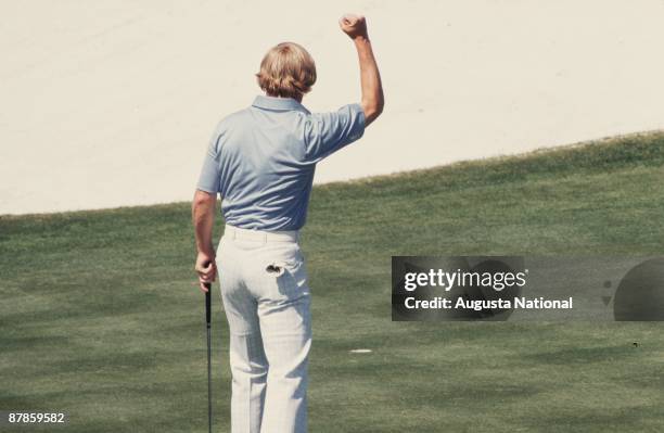 Johnny Miller drops his putt during the 1975 Masters Tournament at Augusta National Golf Club in April 1975 in Augusta, Georgia.