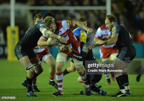 Tom Savage of Gloucester Rugby tries to break through the Newcastle Falcons' defence during the Aviva Premiership match between Newcastle Falcons and...