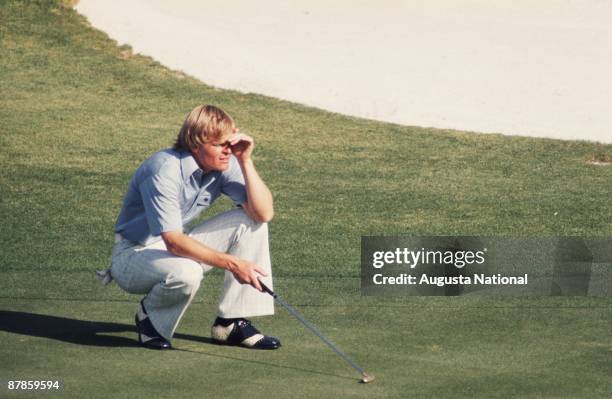 Johnny Miller lines up a putt during the 1975 Masters Tournament at Augusta National Golf Club in April 1975 in Augusta, Georgia.