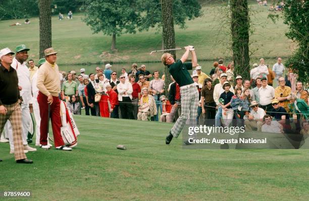 Johnny Miller tees off as Sam Snead and Billy Casper watch during the 1975 Masters Tournament at Augusta National Golf Club in April 1975 in Augusta,...