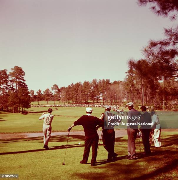 Don Cherry tees off on the 13th hole as Arnold Palmer, Byron Nelson, and Bill Hyndman watch during the 1962 Masters Tournament at Augusta National...