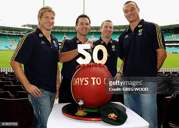 Australian cricketers , Shane Watson, captain Ricky Ponting, Brad Haddin and Stuart Clark pose with a '50 days to go' cake at the Sydney Cricket...