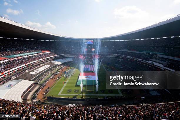 Fireworks are set off during the pregame show before the New England Patriots and the Oakland Raiders play at Estadio Azteca on November 19, 2017 in...