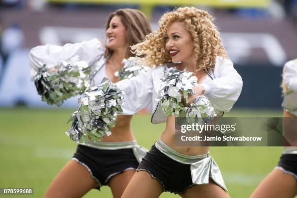 The Oakland Raiderettes dance during the game between the New England Patriots and the Oakland Raiders at Estadio Azteca on November 19, 2017 in...