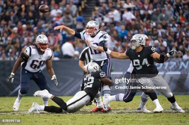 Quarterback Tom Brady of the New England Patriots passes against of the Oakland Raiders at Estadio Azteca on November 19, 2017 in Mexico City, Mexico.
