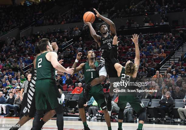 Butler University guard Kamar Baldwin goes up for a shot over Portland State University guard Holland Woods in a college basketball game during the...