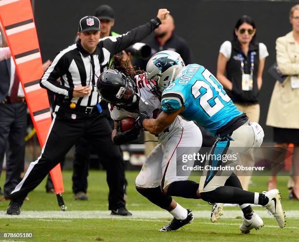 Carolina Panthers free safety Kurt Coleman wraps up Atlanta Falcons running back Devonta Freeman in the fourth quarter on Sunday, Nov. 5, 2017 at...