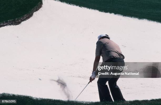 Billy Casper chips out of a bunker during the 1979 Masters Tournament at Augusta National Golf Club in April 1979 in Augusta, Georgia.