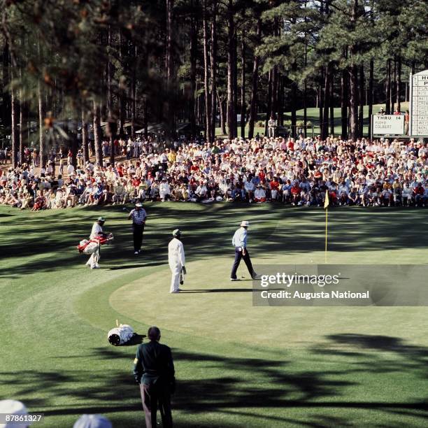 Raymond Floyd and Jim Colbert on the 15th green during the 1977 Masters Tournament at Augusta National Golf Club in April 1977 in Augusta, Georgia.