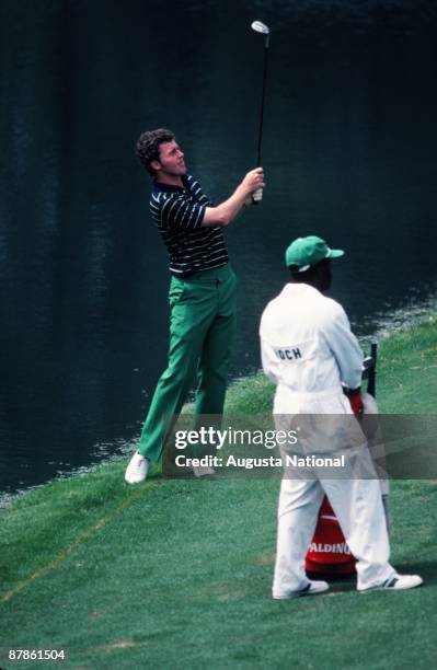 Scott Hoch watches his shot from the edge of the water hazard during the 1979 Masters Tournament at Augusta National Golf Club on April 12th, 1979 in...