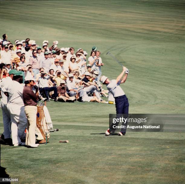 Tom Kite hits off the 12th tee box in front of a large gallery during the 1978 Masters Tournament at Augusta National Golf Club on April 1978 in...