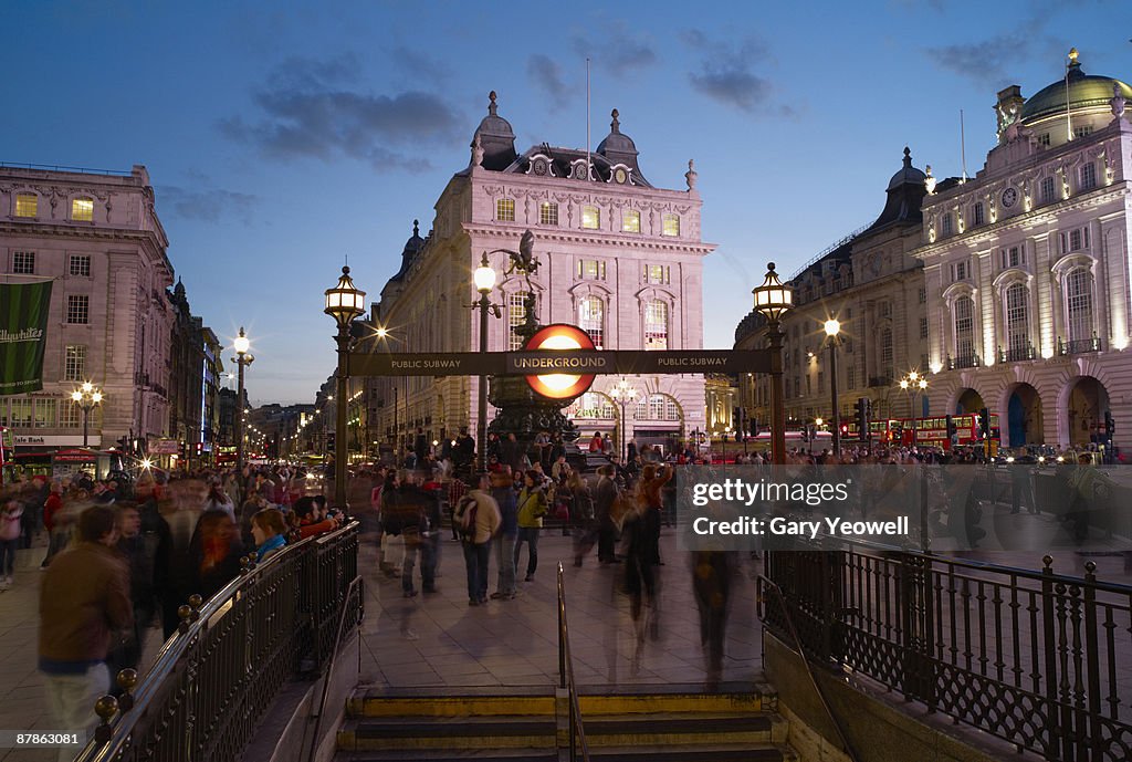 Tourists in Piccadilly Circus at dusk