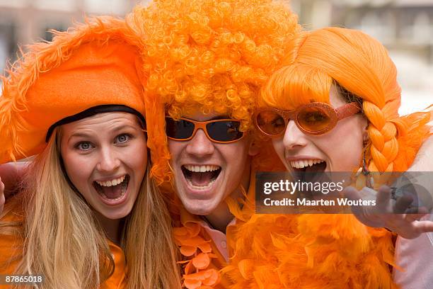 dutch queensday orange folklore mayhem - king's day netherlands bildbanksfoton och bilder