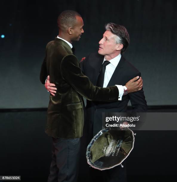 Mutaz Essa Barshim of Qatar receives trophy as from Male Athlete of the Year from IAAF President Sebastian Coe during the IAAF Athletics Awards 2017...