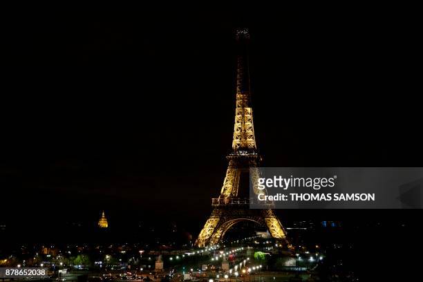 The lights of the Eiffel Tower in Paris are switching off on November 24, 2017 in tribute to the victims of the deadly attack on a mosque in Egypt's...