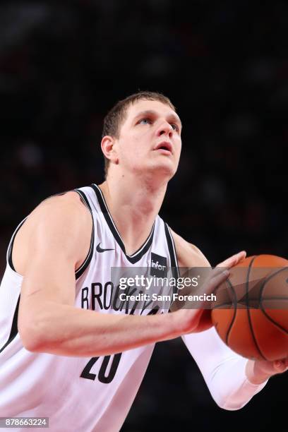 Timofey Mozgov of the Brooklyn Nets shoots a free throw against the Portland Trail Blazers on November 10, 2017 at the Moda Center in Portland,...