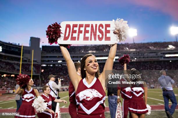 Cheerleader of the Arkansas Razorbacks tries to get the crowd cheering during a game against the Missouri Tigers at Razorback Stadium on November 24,...
