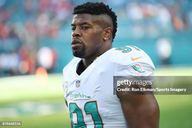 Cameron Wake of the Miami Dolphins looks on before a NFL game against the Tampa Bay Buccaneers at Hard Rock Stadium on November 19, 2017 in Miami...