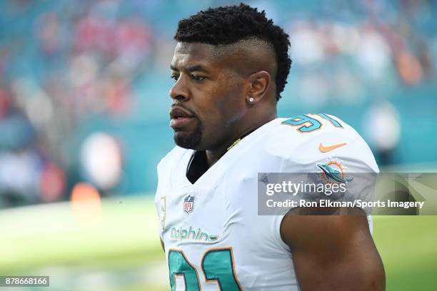 Cameron Wake of the Miami Dolphins looks on before a NFL game against the Tampa Bay Buccaneers at Hard Rock Stadium on November 19, 2017 in Miami...