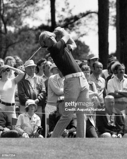 1970s: Johnny Miller watches the flight of his ball during a 1970s Masters Tournament at Augusta National Golf Club in Augusta, Georgia.