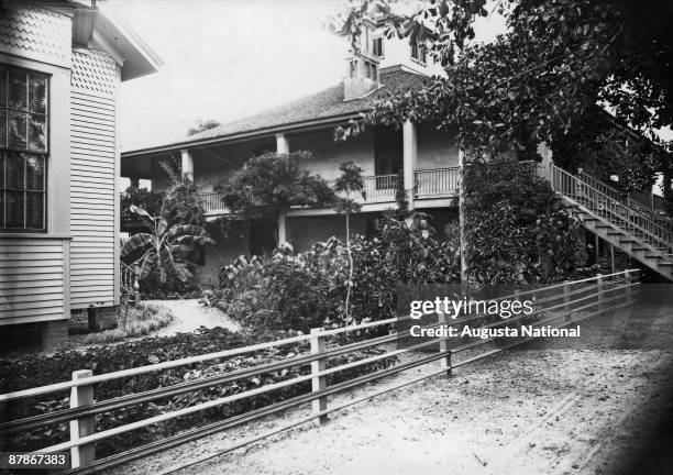 Side view of the clubhouse when it was used as a residence by the Berckmans family, showing their many plantings, at Fruitland Nurseries, later to...