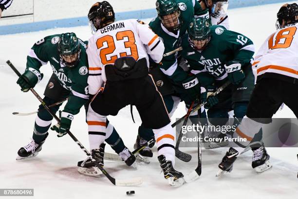 Ethan Somoza of the Bemidji State Beavers faces off against Jeremy Germain of the Princeton Tigers during the first period at Hobey Baker Rink on...