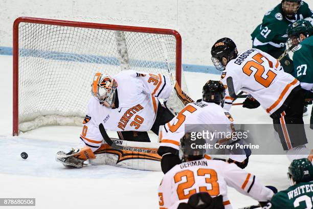 Ryan Ferland of the Princeton Tigers eyes a wide shot on goal against the Bemidji State Beavers during the first period at Hobey Baker Rink on...