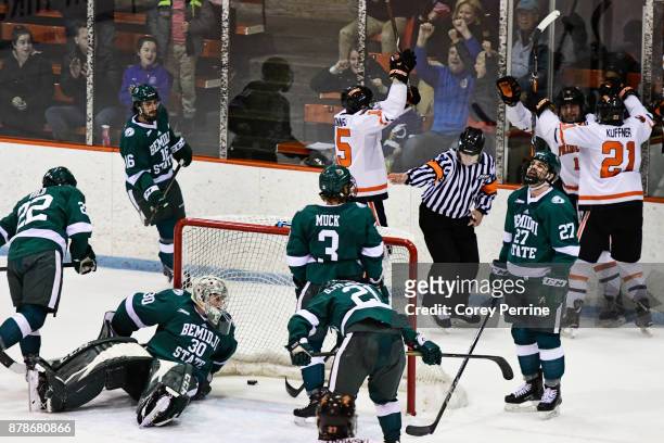 Jack Burgart of the Bemidji State Beavers eyes the second goal, putting them ahead, from the Princeton Tigers late in the second period at Hobey...
