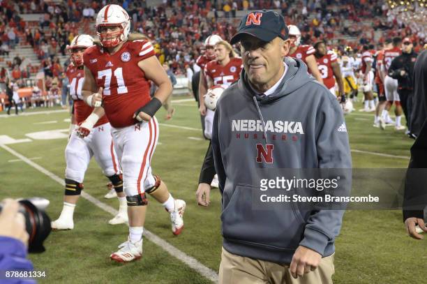 Head coach Mike Riley of the Nebraska Cornhuskers walks off the field after the game against the Iowa Hawkeyes at Memorial Stadium on November 24,...