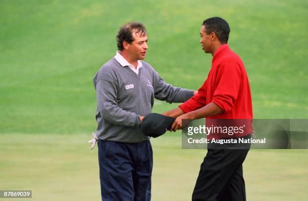 Tiger Woods shakes hands with Costantino Rocca after winning the 1997 Masters Tournament at Augusta National Golf Club on April 13, 1997 in Augusta,...