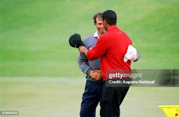 Tiger Woods shakes hands with Costantino Rocca after winning the 1997 Masters Tournament at Augusta National Golf Club on April 13, 1997 in Augusta,...