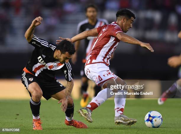 Ignacio Scocco of River Plate fights for ball with Nelson Acevedo of Union during a match between River and Union as part of Superliga 2017/18 at...
