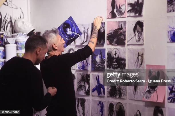 The assistants of the italian Graphic Novelist and artist Stefano Ricci works on the set up of his exhibition 'Segnosonico' during Bil Bol Bul...