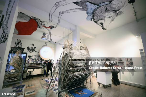The assistants of the italian Graphic Novelist and artist Stefano Ricci works on the set up of his exhibition 'Segnosonico' during Bil Bol Bul...