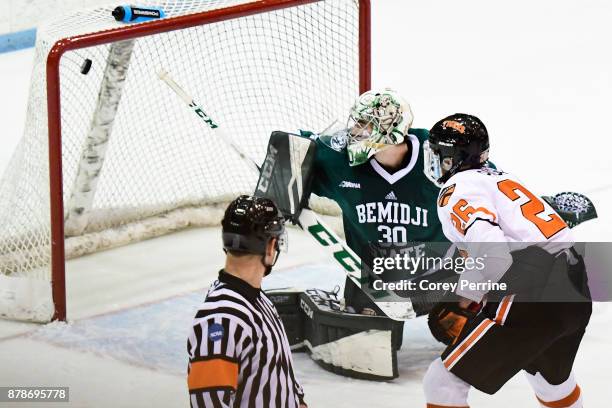 Jake Paganelli of the Princeton Tigers scores the final goal for the Princeton Tigers against Jack Burgart of the Bemidji State Beavers during the...