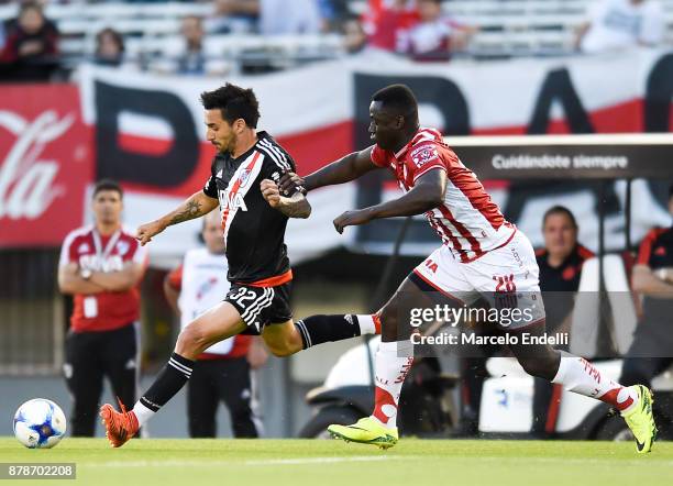 Ignacio Scocco of River Plate fights for ball with Yeimar Gomez of Union during a match between River and Union as part of Superliga 2017/18 at...